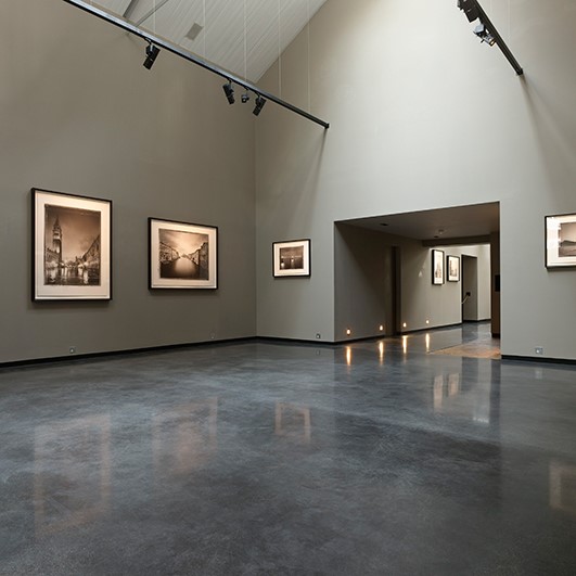 Dark acid stained concrete floor with a polished finish