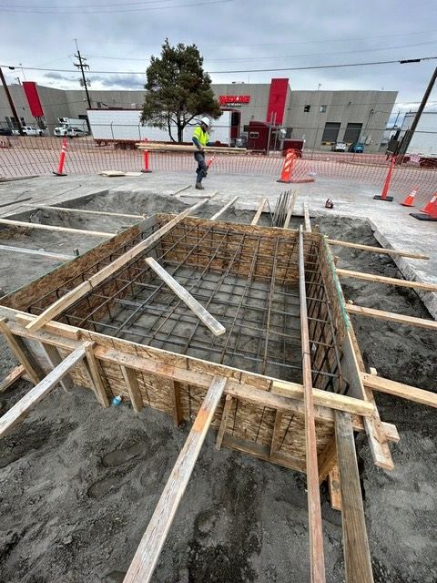 Forms and tied rebar for a concrete tank pad